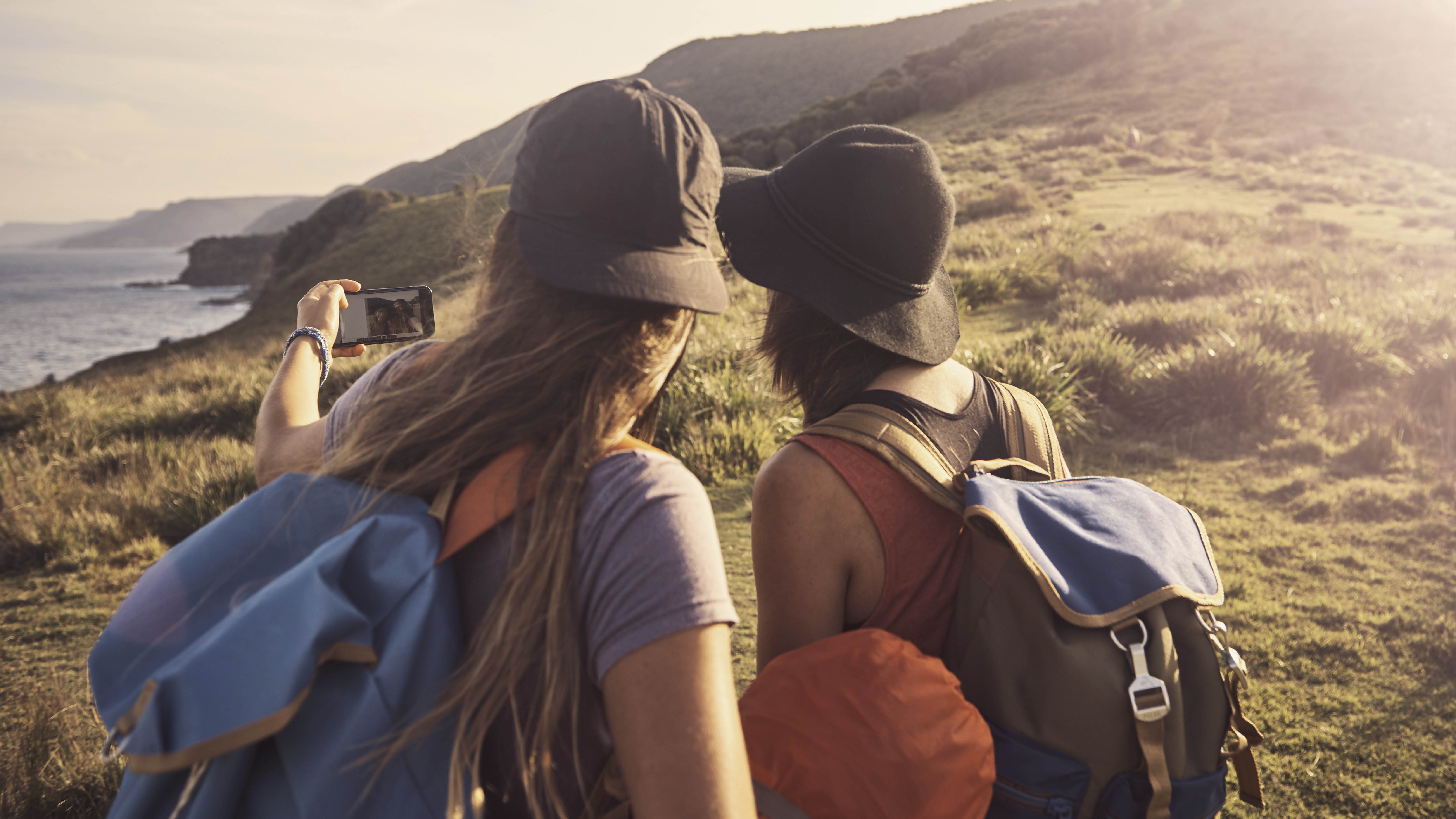 Hiking friends taking a picture - March 2025 Feature